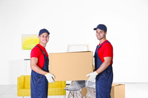 Removal specialists managing fragile items during a Brentcross flat move