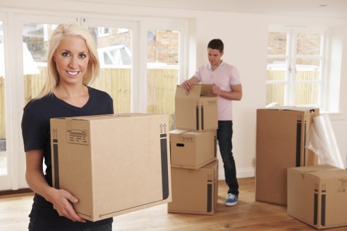 Professional removal team planning a Brent Cross residential move with boxes and furniture