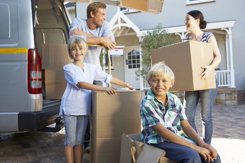 Brentcross movers carefully packing household items for transport