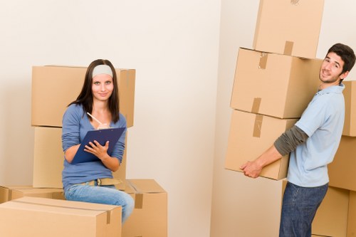 Movers securing household items for safe transport in Brentcross