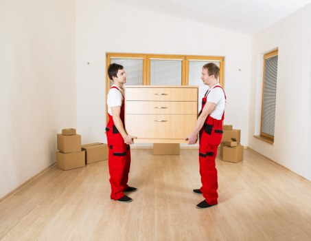 Staff using PPE while handling furniture safely